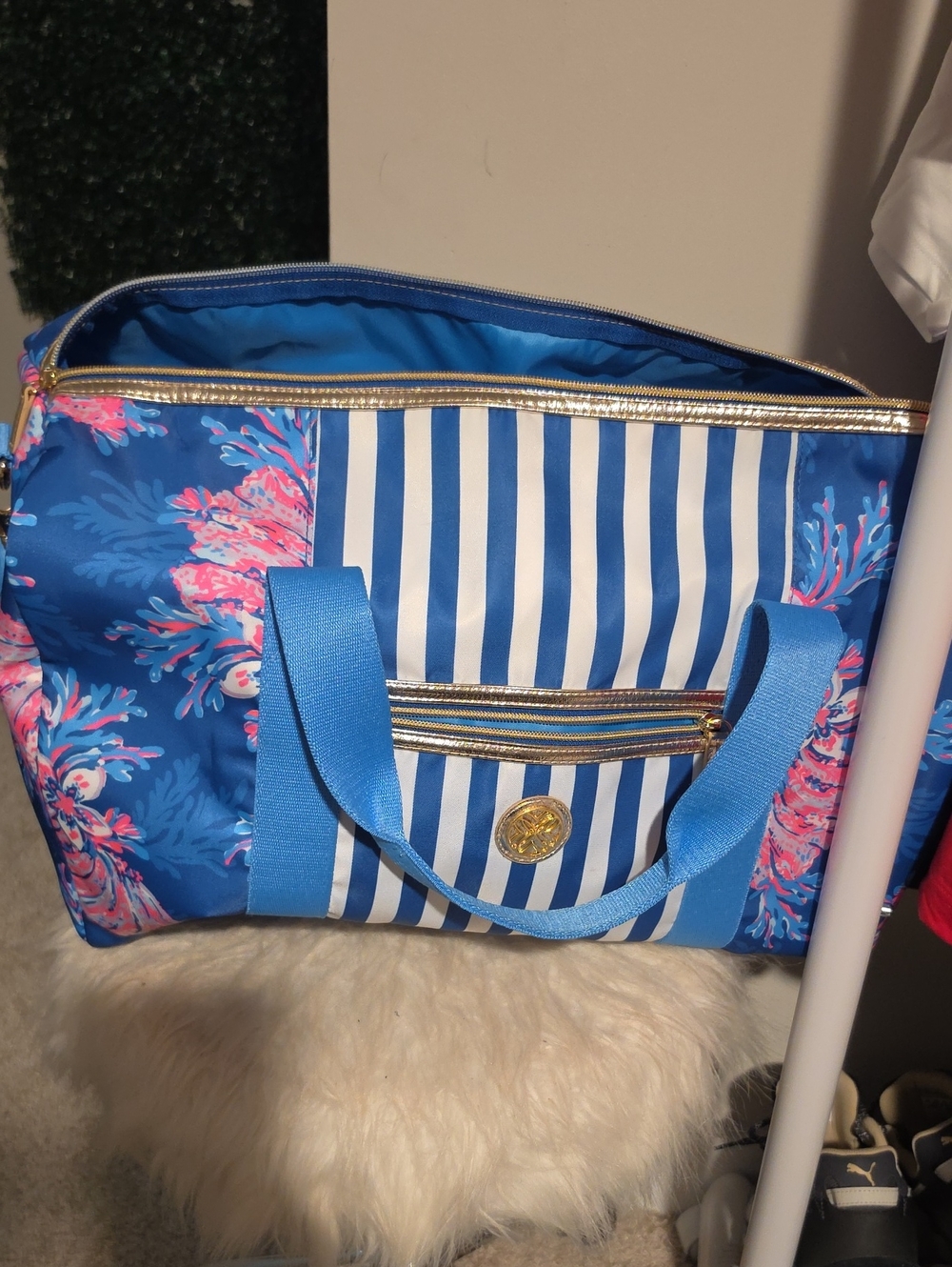 Lilly Pulitzer "For the Fans" overnight bag featuring a bright floral.